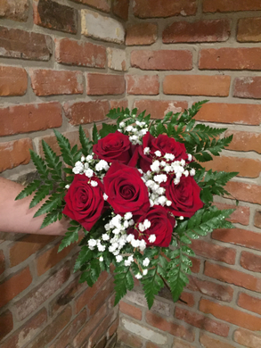 Half dozen of our premium Explorer Red Roses hand tied with babies breath and an assortment of foliages ready for your recipient to drop in their vase!