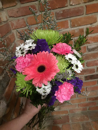 A cheerful mix of long lasting blooms!  All orders are subject to substitutions as needed. Our designers will take care to preserve the aesthetic and value of your original choice.   Available for delivery in Kenora.